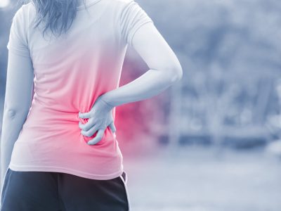 sport woman waist injury in the park,great for your design