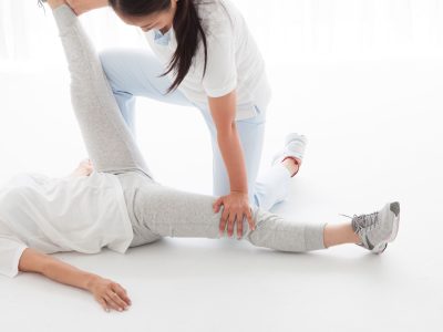 Physio Therapist have stretch a woman's hip